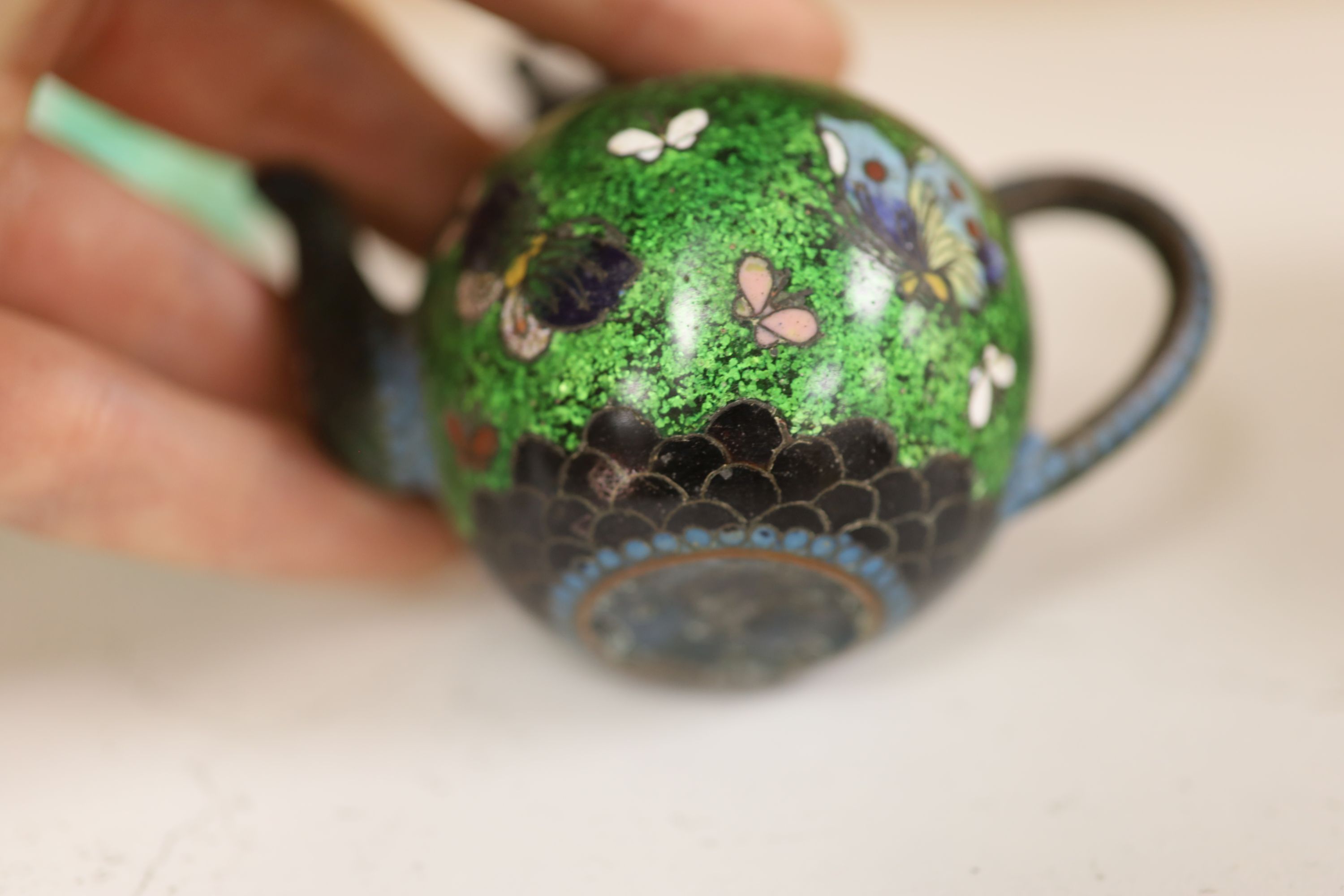 A small miscellaneous Oriental collection including enamel snuff boxes, Buddha carvings etc.
